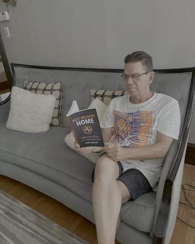 Frank reading Self-Reliant Home