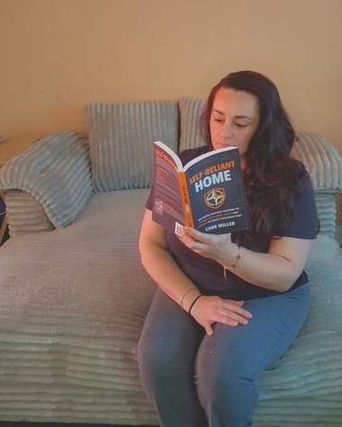 Nicola reading Self-Reliant Home